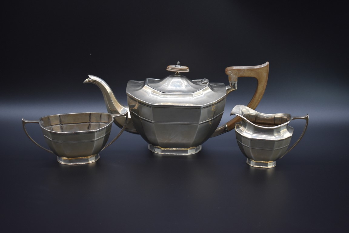 A silver three piece tea set, by Cooper Brothers & Sons Ltd, Sheffield 1931, 1035g all in.