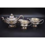 A good George IV silver three piece tea set, by J E Terrey & Co, London 1821, each heavily chased