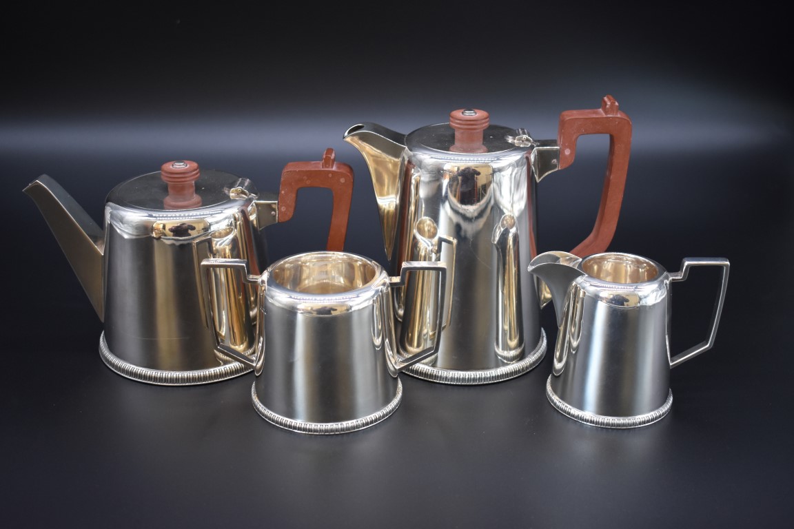 A silver four piece tea set, by Walker & Hall, Sheffield 1945, 1650g all in.