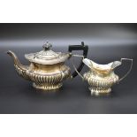 An Edwardian silver teapot and twin handled sugar bowl, by William Adams Ltd, Birmingham 1907,