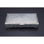 A Persian white metal cigarette box, probably Isfahan, stamped to inner lid, 14cm wide.