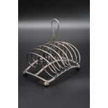 A George III silver toast rack, by Matthew Boulton, Birmingham 1809, 15.5cm wide, 284g.