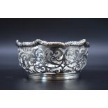 A late Victorian pierced silver bonbon dish, by Carrington & Co, London 1900, 9.8cm diameter, 121g.