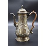A George III silver coffee pot, by Walter Brind, London 1760, having later rococo decoration,