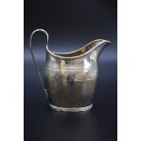 A George III silver milk jug, London 1800, 10.5cm high, 114g.