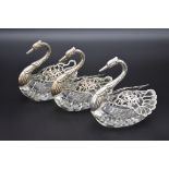 Three silver mounted cut glass swan bonbon dishes, By E Ltd, Import mark London 1962 and 1967, 12.