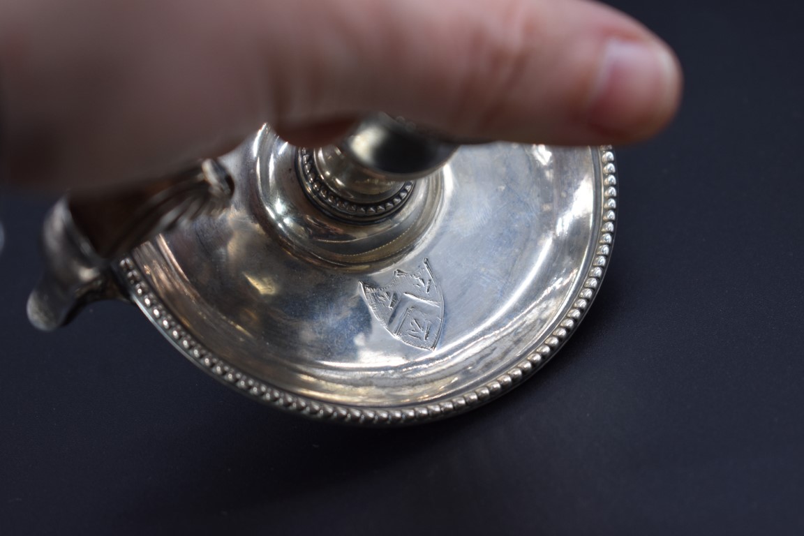 A George III silver chamberstick, by Henry Hubert, London 1778, 9cm diameter, 108g. - Image 4 of 5