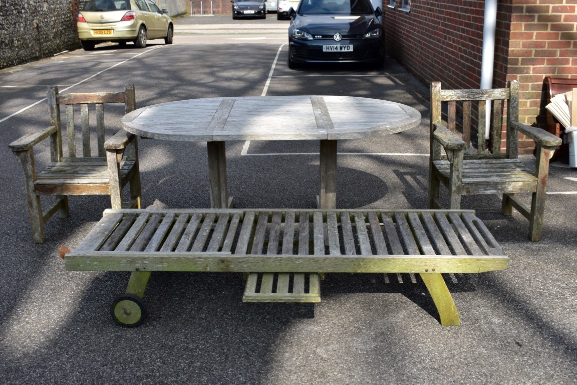 A teak garden table, 181 x 120cm; together with a pair of teak armchairs and a teak lounge chair. - Image 2 of 9