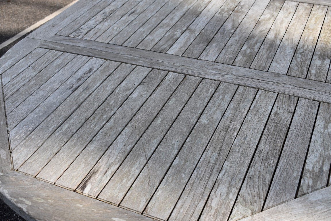 A teak garden table, 181 x 120cm; together with a pair of teak armchairs and a teak lounge chair. - Image 8 of 9