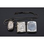 An Edwardian silver vesta case, by Boots Pure Drug Company, Chester 1903, 4cm; together with two