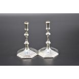 A pair of Victorian cast silver taper sticks, by Thomas Bradbury & Sons, London 1895, 11cm high,