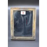 A silver rectangular photograph frame, by Mappin & Webb, Sheffield 1996, 22 x 17cm.