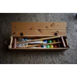 An old croquet set, in wooden box.