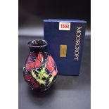 A Moorcroft 'Anemone' pattern vase, 13.5cm high, boxed.