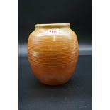 A vintage Moorcroft orange lustre glazed ovoid vase, 19cm high.