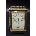 An antique brass carriage clock, with bell striking alarm, height including handle 14.5cm, (cracks