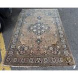 A Persian rug, with central floral medallion and floral cartouches to each corner, 205 x 128cm.