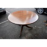 A reproduction mahogany and brass strung circular table, 100cm diameter.