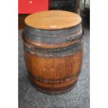 An old coopered oak barrel and cover.