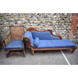 An antique chaise longue; together with a bergere armchair.