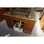 A late Victorian oak pedestal desk, 121.5cm wide.