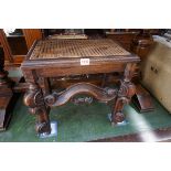 A 17th century style oak and cane stool, 44cm wide.