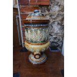 A Royal Doulton stoneware cistern and cover, 39.5cm high, (chips).