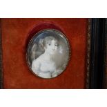 English School, early 19th century, bust length portrait miniature of an elegant lady wearing