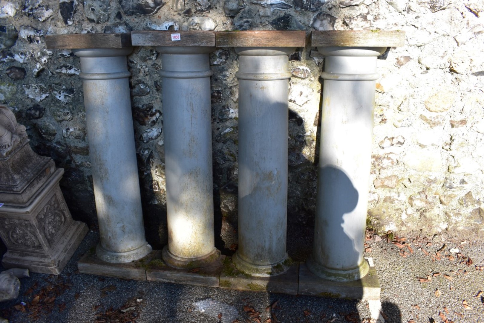 A set of four painted wood pilasters, 103cm high.