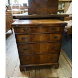 A small reproduction mahogany bachelor's chest, with foldover top, 61cm wide.