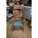 A circa 1900 carved oak rocking chair.