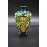 A small Moorcroft 'Trial' vase, inscribed and dated 27.8.98, 15.5cm high.