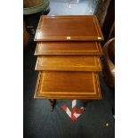 A nest of late Victorian mahogany and satinwood crossbanded quartetto tables, largest 56cm wide.