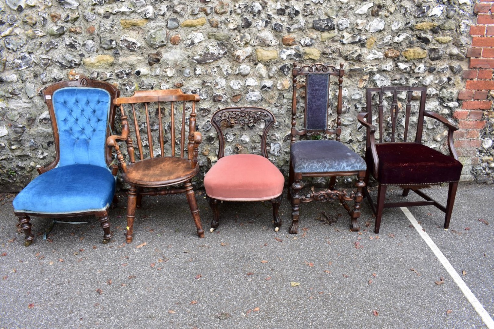 An antique mahogany nursing chair; together with a captains type chair and three others.