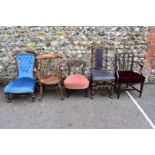 An antique mahogany nursing chair; together with a captains type chair and three others.