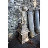 A composition stone garden statue of a boy, with pedestal base, (a.f.).