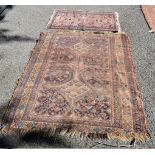 A Persian rug, having three diamonds to central field the central field also decorated with birds,