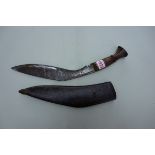 An old kukri and leather sheath.