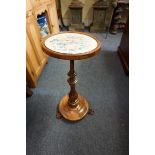 A Victorian rosewood occasional table, the circular top inset with a watercolour painted panel of