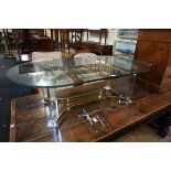 A glass oval low occasional table, on perspex and brass stand, 135cm wide.