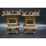 An unusual pair of Chinese gilt metal and pewter mounted mounted lantern stands, late Qing,