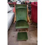 A Victorian walnut and green dralon rocking chair; together with another green dralon footstool.