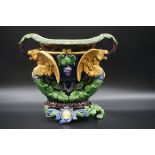 A Victorian Minton majolica twin handled centrepiece, 32cm wide, (large chip and loss to base).