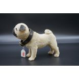 A vintage novelty nodding pug, with plush surface, 19cm high.