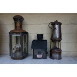 A Wolf miner's lamp; together with a brass hexagonal lantern; and another 'black out' lantern.