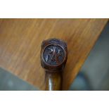 A carved walnut novelty RAF cane.