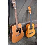 A Yasuma Jumbo 155 acoustic guitar; together with another acoustic guitar.
