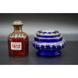 An antique cranberry glass and brass mounted scent bottle, 10cm high; together with another Bohemian