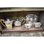 An Art Deco electroplated four piece teaset; together with a similar sandwich plate.