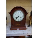 An Edwardian mahogany and inlaid mantel clock, 31cm high.